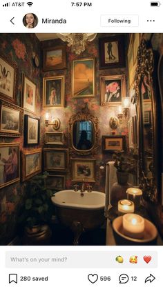 a bathroom with pictures on the walls and a tub in the middle, surrounded by candles