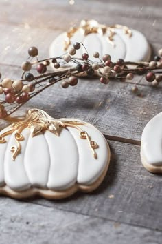 decorated cookies sitting on top of a wooden table