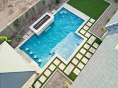 an aerial view of a swimming pool in a backyard