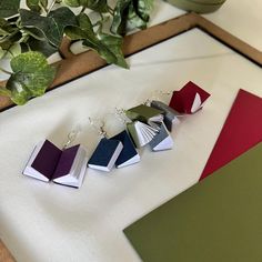 the book earrings are made from folded books