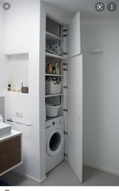 a washer and dryer in a small room