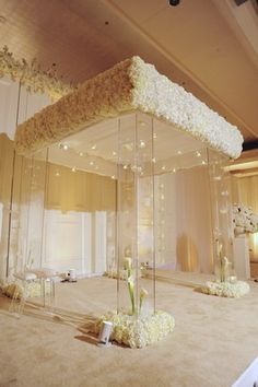 a room filled with lots of white flowers