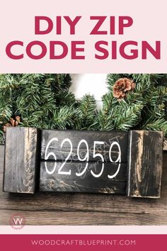 a sign that says diy zip code sign with pine cones and evergreen branches in the background