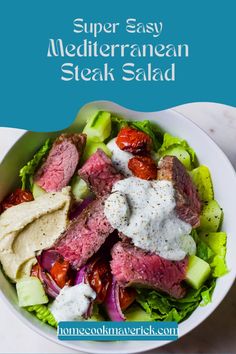 a white bowl filled with steak salad and dressing on top of a marble countertop