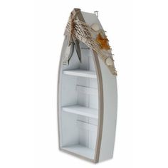 a boat shaped book shelf with seashells and starfish on the top, in front of a white background