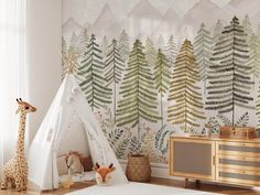 a child's room with a teepee tent and giraffe wallpaper