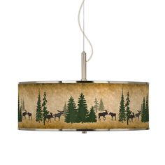 a lamp shade with moose and trees on it, hanging from a ceiling light fixture