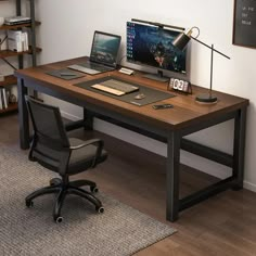 a computer desk with a laptop, keyboard and mouse sitting on it in front of a bookshelf