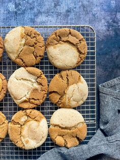 a cooling rack filled with cookies on top of a table