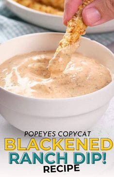 a person dipping some food into a bowl with the words popyes copycatt blackned ranch dip recipe