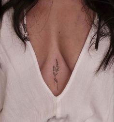 a woman with a tattoo on her chest