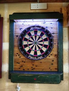 a dart board mounted to the side of a wall