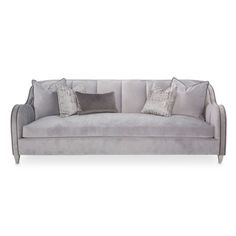 a gray couch with pillows on it