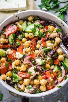 greek chickpea salad in a white bowl