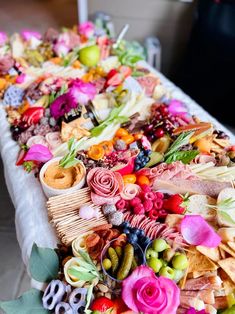 a long table covered with lots of different types of food and decorations on it's sides