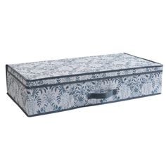 a blue and white floral print storage box