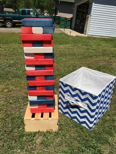 two boxes are stacked on top of each other in the grass