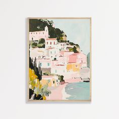 a painting hanging on the wall in front of a white wall with an ocean view