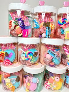 several plastic containers filled with candy and candies