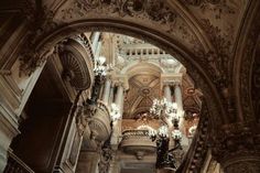 an ornate building with chandeliers and lights