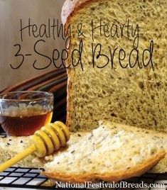 a close up of bread with honey on top and the words healthy & hearty 2 - seed bread