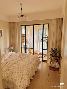 a bed sitting in a bedroom next to a sliding glass door