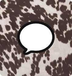 a brown and white spotted animal print with a speech bubble on it's side