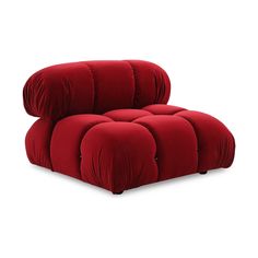 a red reclining chair with buttons on the armrests and back cushions, in front of a white background