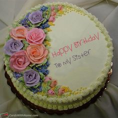 a birthday cake decorated with flowers and the words happy birthday grisel on it