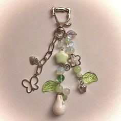 a close up of a key chain with charms