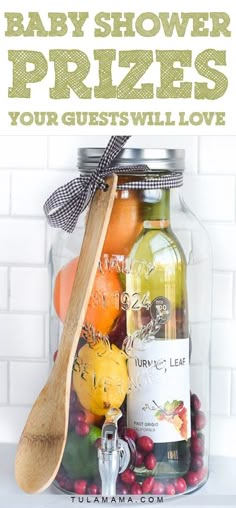 baby shower prizes that your guests will actually love are in a glass jar with a wooden spoon