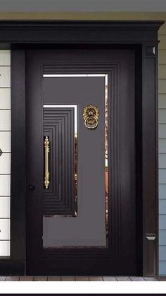 a black front door with two sidelights and a gold handle on the bottom panel