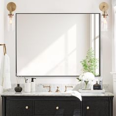 a bathroom vanity with a large mirror above it