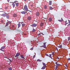 an image of a pink and red flowered fabric with purple flowers on white background