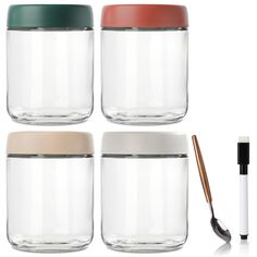 four glass jars with lids, one has a straw and the other has a spoon