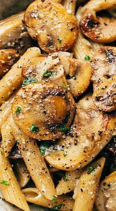 pasta with mushrooms and parmesan cheese in a bowl