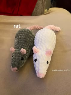 two stuffed animals laying on top of a bed next to each other with the caption rat and gerbil