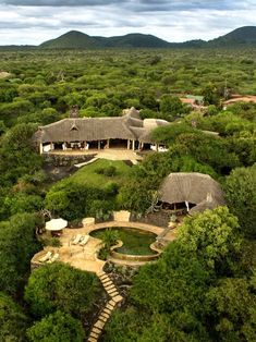 an aerial view of a house surrounded by trees