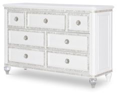 an ornate white dresser with drawers and knobs on the doors is featured against a white background