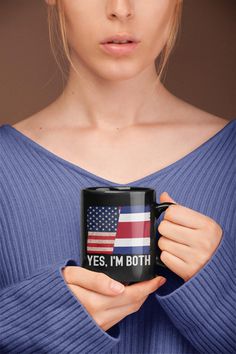 a woman holding a coffee mug with the words yes, i'm both