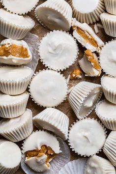 some white chocolates with icing and nuts on top