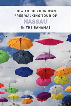 colorful umbrellas hanging in the air with text overlay reading how to do your own free walking tour of nasau in the bananas