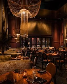 a fancy restaurant with chandeliers hanging from the ceiling