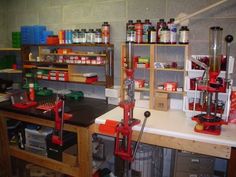 a workbench filled with lots of tools and other items on shelves in a room