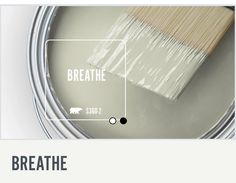 a paint can with the words breathe painted on it and an image of a brush