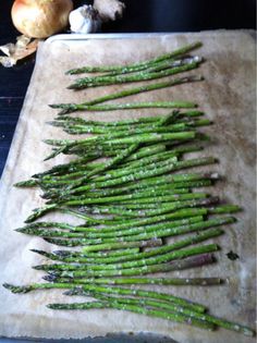 the asparagus are ready to be cooked on the stove top and put in the oven