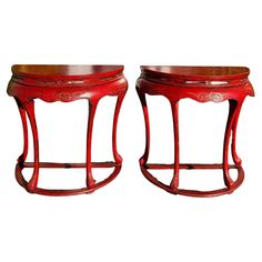 two red wooden tables sitting next to each other