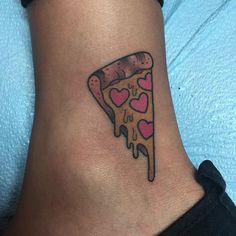 a slice of pizza with hearts on the side of her leg is shown in this tattoo