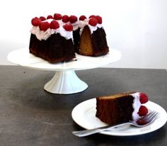 there is a piece of cake with raspberries on it and a fork next to it