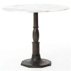 a white marble top table with an iron base